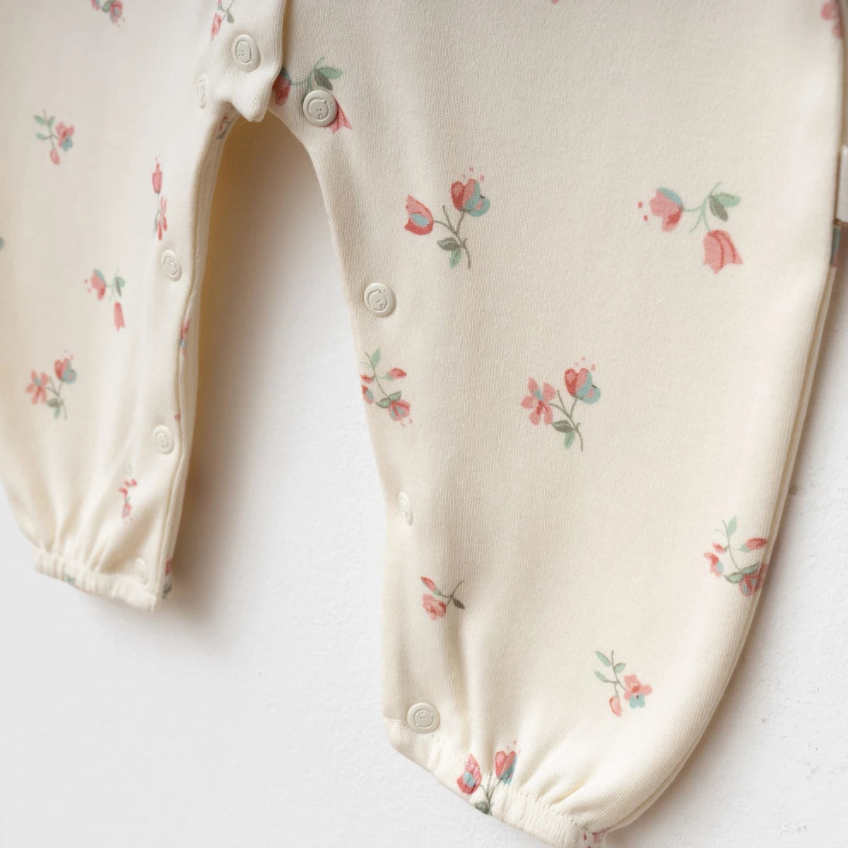 Strampler Creme Blumenmuster Haarband